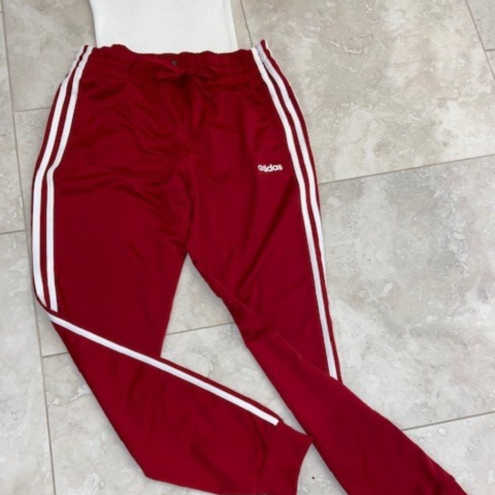 Women's red Adidas track pants